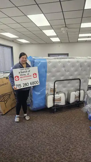 Customer picking up a new mattress